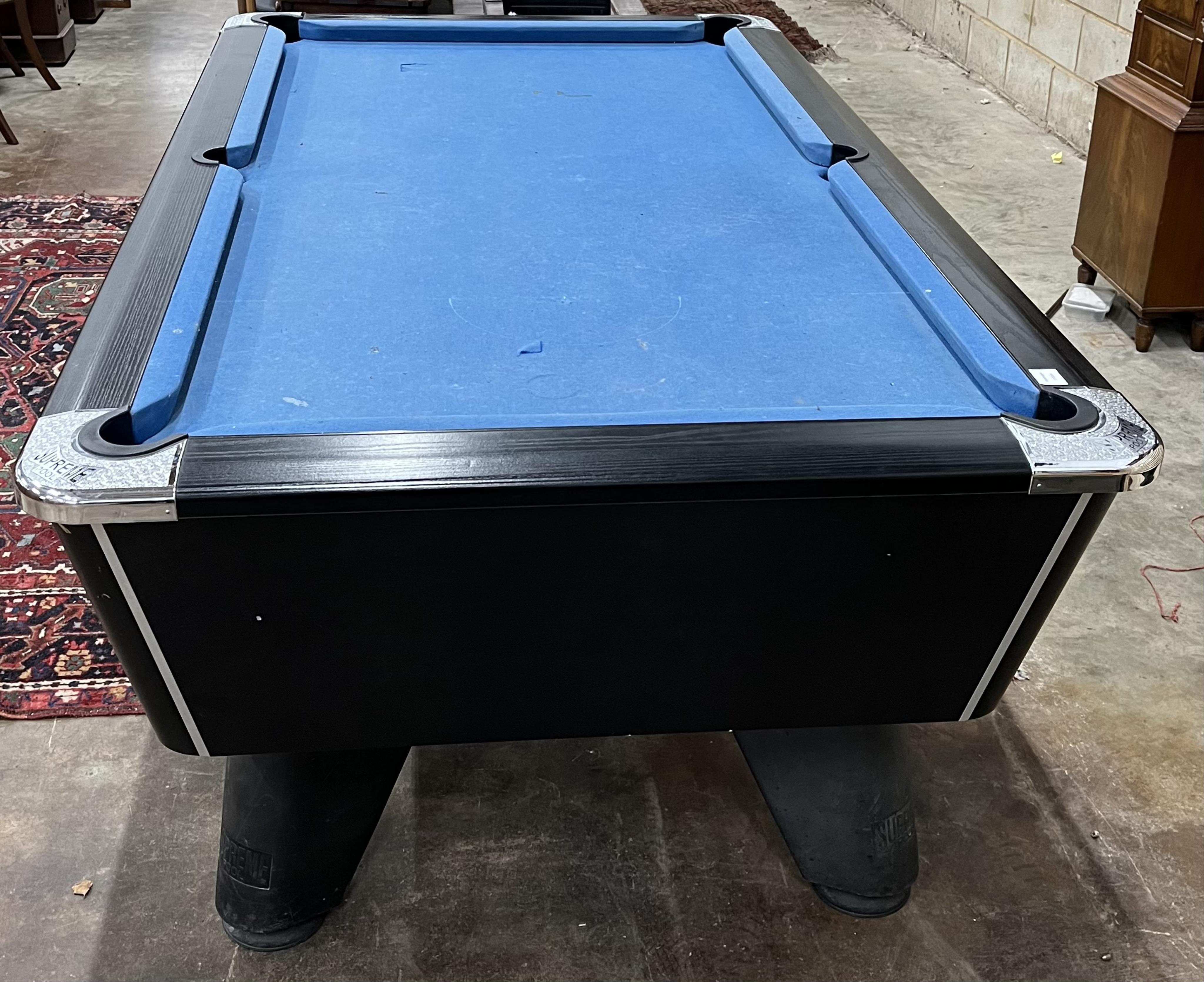 A Supreme pool table with all accessories, width 210cm, depth 120cm, height 82cm. Condition - fair, baize poor